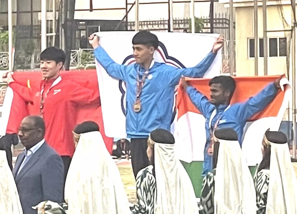 吳育廷（中）奪金。田徑協會提供。